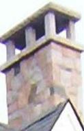 Granite chimney, custom built, with granite piers and granite cap