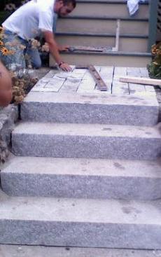 granite steps with a cobblestone landing